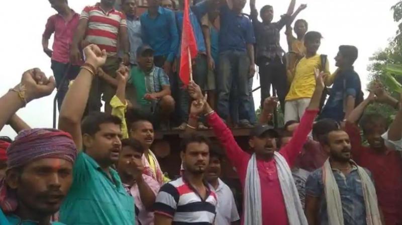 Protesters stopped trains in Bihar’s Darbhanga and Munger and high alert was issued in 35 districts of Madhya Pradesh. (Photo: ANI) Protesters stopped trains in Bihar’s Darbhanga and Munger and high alert was issued in 35 districts of Madhya Pradesh. (Photo: ANI)