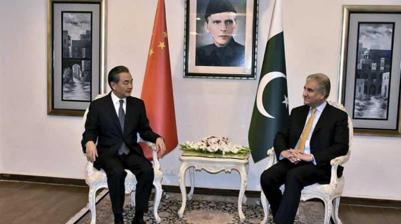 In this picture released by Press Information Department, visiting Chinese foreign minister Wang Yi, left, meets with his Pakistani counterpart Shah Mahmood Qureshi, in Islamabad. (Photo: AP) In this picture released by Press Information Department, visiting Chinese foreign minister Wang Yi, left, meets with his Pakistani counterpart Shah Mahmood Qureshi, in Islamabad. (Photo: AP)
