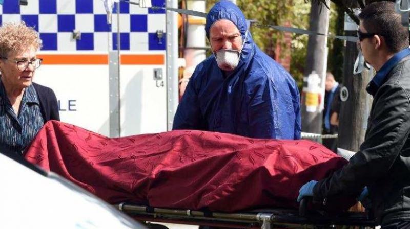 Forensic police (C) and other officials remove a dead body from the crime site in the suburb of Australia's western city of Perth on September 10, 2018. (Photo: AFP) Forensic police (C) and other officials remove a dead body from the crime site in the suburb of Australia's western city of Perth on September 10, 2018. (Photo: AFP)