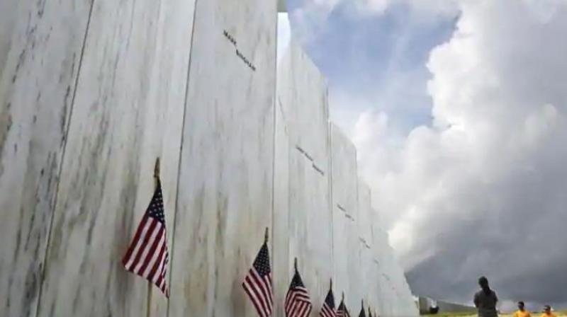 Visitors to the Flight 93 National Memorial pause at the Wall of Names honouring 40 passengers and crew members of United Flight 93 killed when the hijacked jet crashed at the site during the 9/11 terrorist attacks, near Shanksville, Pennsylvania. (Photo: AP) Visitors to the Flight 93 National Memorial pause at the Wall of Names honouring 40 passengers and crew members of United Flight 93 killed when the hijacked jet crashed at the site during the 9/11 terrorist attacks, near Shanksville, Pennsylvania. (Photo: AP)