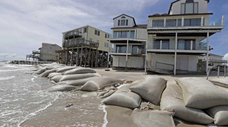 Sand bags surround homes on North Topsail Beach, N.C., Wednesday, Sept. 12, 2018, as Hurricane Florence threatens the coast. (Photo: AP) Sand bags surround homes on North Topsail Beach, N.C., Wednesday, Sept. 12, 2018, as Hurricane Florence threatens the coast. (Photo: AP)