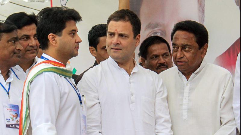Congress President Rahul Gandhi C Congress leader and MP Jyotiraditya Madhavrao Scindia L and State President Kamal Nath during a roadshow in Bhopl. (Photo: PTI) Congress President Rahul Gandhi C Congress leader and MP Jyotiraditya Madhavrao Scindia L and State President Kamal Nath during a roadshow in Bhopl. (Photo: PTI)