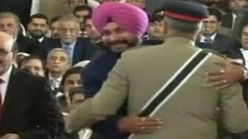 Navjot Singh Sidhu courted controversy by hugging Pakistan Army chief Qamar Javed Bajwa during his visit to Pakistan for the swearing-in of Imran Khan as Prime Minister last month. (Photo: File) Navjot Singh Sidhu courted controversy by hugging Pakistan Army chief Qamar Javed Bajwa during his visit to Pakistan for the swearing-in of Imran Khan as Prime Minister last month. (Photo: File)