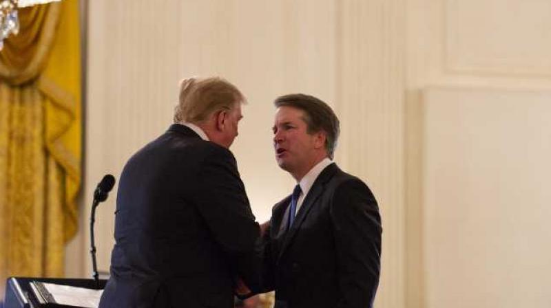 President Donald Trump shakes hands with Brett Kavanaugh, his Supreme Court nominee. (Photo: AP) President Donald Trump shakes hands with Brett Kavanaugh, his Supreme Court nominee. (Photo: AP)