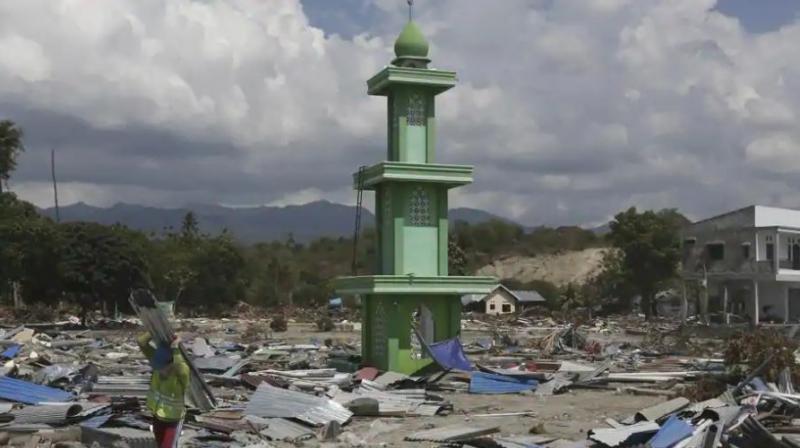 Almost 2,00,000 people need urgent help, the UN’s humanitarian office said, among them tens of thousands of children, with an estimated 66,000 homes destroyed or damaged by the 7.5-magnitude quake and the tsunami it spawned. (Photo: AP) Almost 2,00,000 people need urgent help, the UN’s humanitarian office said, among them tens of thousands of children, with an estimated 66,000 homes destroyed or damaged by the 7.5-magnitude quake and the tsunami it spawned. (Photo: AP)