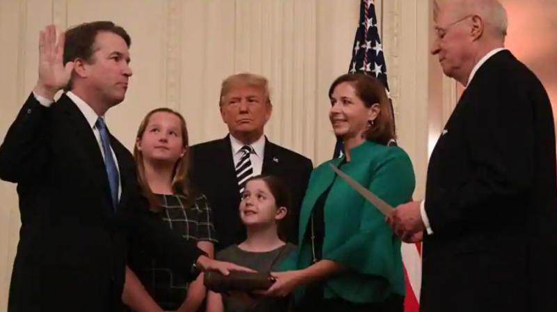 Brett Kavanaugh (L) is sworn in as associate justice of the US Supreme Court as President Donald Trump and the Kavanaugh family looks on.(Photo: AFP) Brett Kavanaugh (L) is sworn in as associate justice of the US Supreme Court as President Donald Trump and the Kavanaugh family looks on.(Photo: AFP)