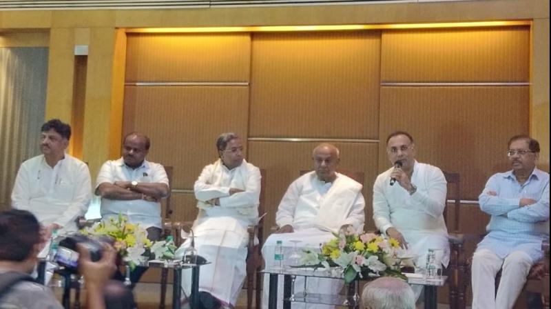 Projecting the unity between both the parties ahead of the November 3 bypolls to three Lok Sabha and two assembly seats in the state, Congress and JD(S) leaders appealed to partymen, who had fought bitterly against each other ahead of May 12 assembly polls, to work unitedly to defeat the BJP. (Photo: @INCKarnataka) Projecting the unity between both the parties ahead of the November 3 bypolls to three Lok Sabha and two assembly seats in the state, Congress and JD(S) leaders appealed to partymen, who had fought bitterly against each other ahead of May 12 assembly polls, to work unitedly to defeat the BJP. (Photo: @INCKarnataka)