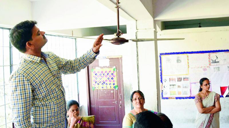 State Commission for Protection of Child Rights (SCPCR) incharge chairperon S. Balaraju inspects the room of Class X student K. Sai Charan who hanged himself at Ravindra Bharathi School in Moghalrajpuram in Vijayawada. (Photo: DC) State Commission for Protection of Child Rights (SCPCR) incharge chairperon S. Balaraju inspects the room of Class X student K. Sai Charan who hanged himself at Ravindra Bharathi School in Moghalrajpuram in Vijayawada. (Photo: DC)
