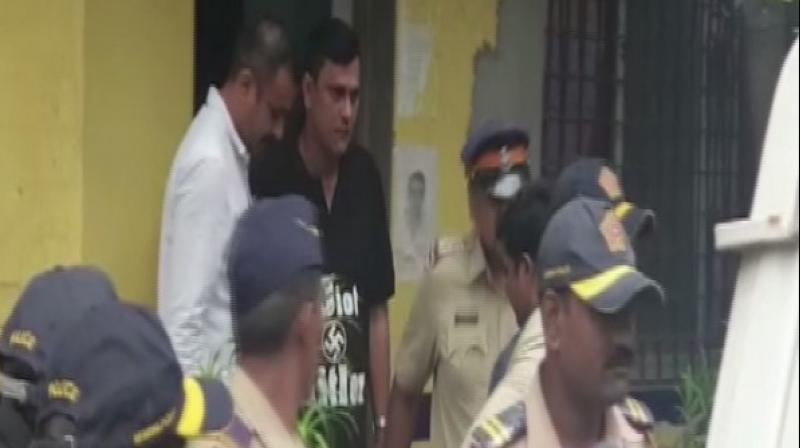 Meanwhile, MNS leader Sandeep Deshpande, wearing a tee shirt with 'EDiot Hitler' emblazoned on it, was taken into custody by police Thursday morning. (Photo: ANI) Meanwhile, MNS leader Sandeep Deshpande, wearing a tee shirt with 'EDiot Hitler' emblazoned on it, was taken into custody by police Thursday morning. (Photo: ANI)