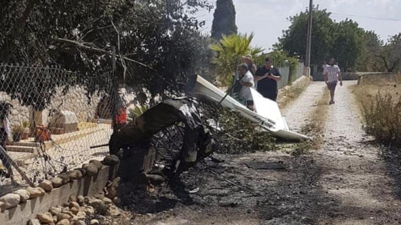 Seven people including two children were killed in a mid-air collision between a helicopter and a light aircraft over Spain's Mallorca island on Sunday, authorities said. (Photo: AP) Seven people including two children were killed in a mid-air collision between a helicopter and a light aircraft over Spain's Mallorca island on Sunday, authorities said. (Photo: AP)