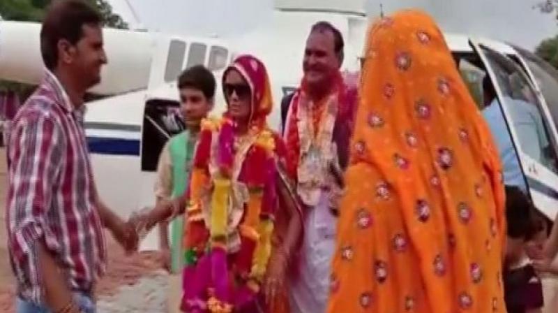 After his wife once asked him how much it would cost to hire a chopper, a school teacher in Rajasthan's Alwar decided to fulfil her wish on his retirement. (Photo: ANI) After his wife once asked him how much it would cost to hire a chopper, a school teacher in Rajasthan's Alwar decided to fulfil her wish on his retirement. (Photo: ANI)