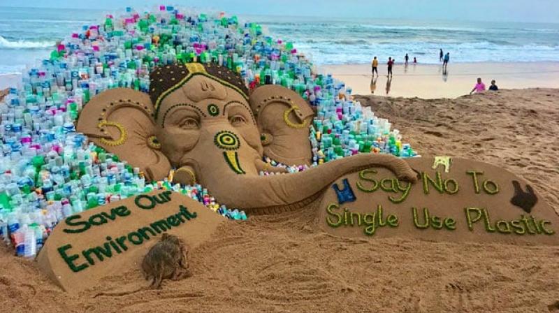 The 10-ft high sand sculpture of Lord Ganesh was created by using 5 tonne of sand, while about 1000 plastic bottles were installed around it, he said. (Photo: Twitter/ sudarsansand) The 10-ft high sand sculpture of Lord Ganesh was created by using 5 tonne of sand, while about 1000 plastic bottles were installed around it, he said. (Photo: Twitter/ sudarsansand)