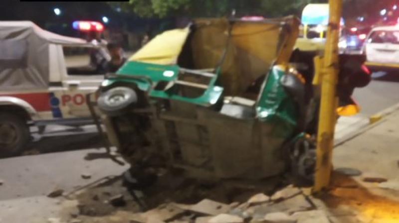 Two people lost their lives while two others were injured when the driver of a dumper truck lost control and ran over autos and pedestrians near India Gate on Man Singh Road in the wee hours of Tuesday. (Photo: Twitter/ ANI) Two people lost their lives while two others were injured when the driver of a dumper truck lost control and ran over autos and pedestrians near India Gate on Man Singh Road in the wee hours of Tuesday. (Photo: Twitter/ ANI)
