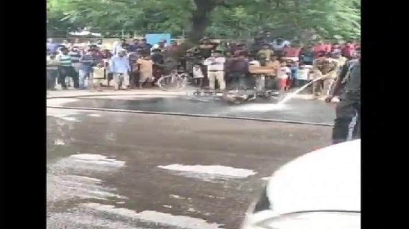 A man allegedly set his motorbike on fire after Delhi traffic police issued a challan to him for violating traffic rules in Sheikh Sarai area on Thursday. (Photo: ANI) A man allegedly set his motorbike on fire after Delhi traffic police issued a challan to him for violating traffic rules in Sheikh Sarai area on Thursday. (Photo: ANI)