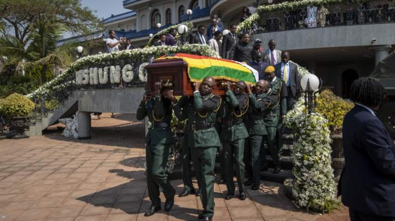 The burial of Zimbabwe's founding president, President Robert Mugabe , will be delayed for at least a month until a special mausoleum can be built at a prominent spot at the national Heroes' Acre monument, the latest turn in a dramatic tussle between his family and the country's current leader, a once-trusted deputy who helped oust Mugabe from power. (Photo: AP) The burial of Zimbabwe's founding president, President Robert Mugabe , will be delayed for at least a month until a special mausoleum can be built at a prominent spot at the national Heroes' Acre monument, the latest turn in a dramatic tussle between his family and the country's current leader, a once-trusted deputy who helped oust Mugabe from power. (Photo: AP)