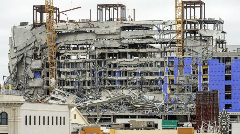 One person died and at least 18 others were injured Saturday when the top floors of a New Orleans hotel that was under construction collapsed, officials said. (Photo: AP) One person died and at least 18 others were injured Saturday when the top floors of a New Orleans hotel that was under construction collapsed, officials said. (Photo: AP)
