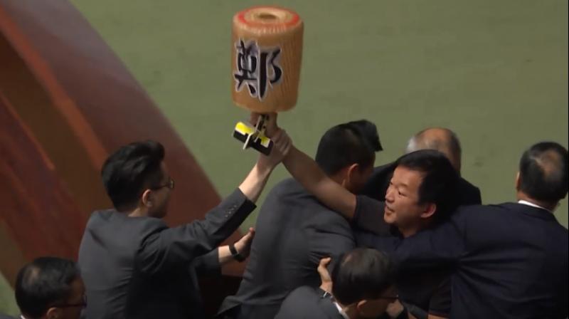 Pro-democracy lawmakers were dragged out of Hong Kong's legislature by security guards on Thursday after they heckled the city's pro-Beijing leader for a second day running, the latest outburst of political rancour in the strife-torn city. (Photo: screengrab/ AFP video) Pro-democracy lawmakers were dragged out of Hong Kong's legislature by security guards on Thursday after they heckled the city's pro-Beijing leader for a second day running, the latest outburst of political rancour in the strife-torn city. (Photo: screengrab/ AFP video)