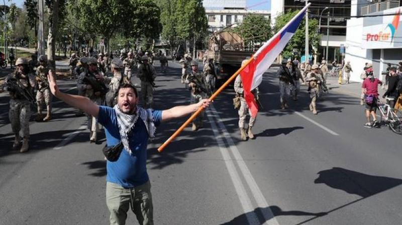The death toll in Chile's anti-government protests rose to 10 in the capital Santiago, local authorities said. (Photo: ANI) The death toll in Chile's anti-government protests rose to 10 in the capital Santiago, local authorities said. (Photo: ANI)