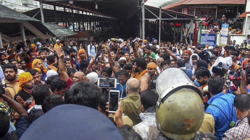 The tension was defused after the woman, who had come with her family members, convinced the protesters that she was above 50 years, and proceeded to the shrine. (Photo: PTI/File) The tension was defused after the woman, who had come with her family members, convinced the protesters that she was above 50 years, and proceeded to the shrine. (Photo: PTI/File)