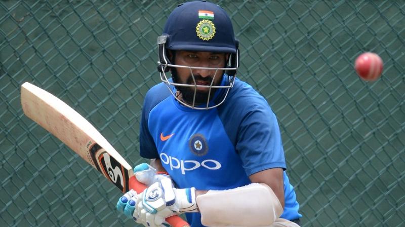 Cheteshwar Pujara, who produced back-to-back big knocks in the Ranji Trophy, was concentration personified during a practice session ahead of the Test series against Sri Lanka.(Photo: AFP) Cheteshwar Pujara, who produced back-to-back big knocks in the Ranji Trophy, was concentration personified during a practice session ahead of the Test series against Sri Lanka.(Photo: AFP)