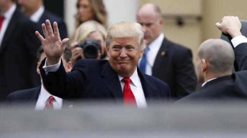 President-elect Donald Trump waves as he walks to his vehicles at a church service at St. John’s Episcopal Church across from the White House in Washington, Friday, Jan. 20, 2017. (Photo: AP) President-elect Donald Trump waves as he walks to his vehicles at a church service at St. John’s Episcopal Church across from the White House in Washington, Friday, Jan. 20, 2017. (Photo: AP)