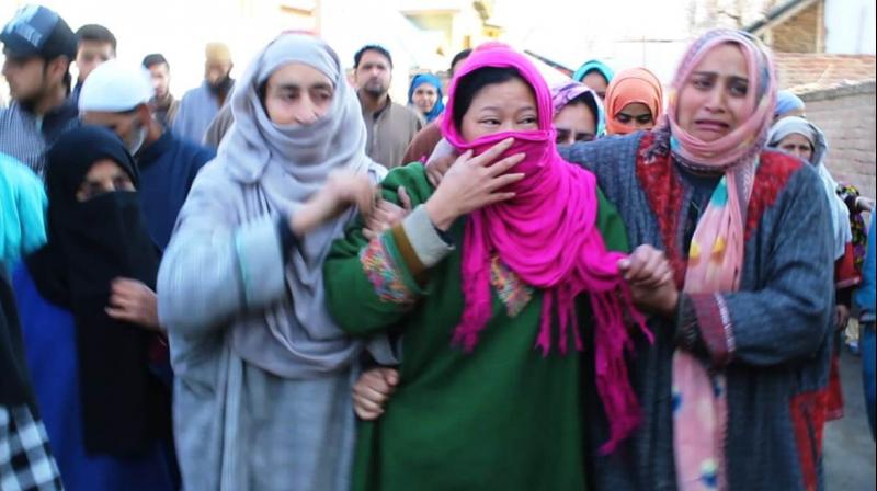Saima (centre), wife of slain Abid Hussain Lone, being consoled by local women in J&K's Pulwama. (Photo: Kashmir Life) Saima (centre), wife of slain Abid Hussain Lone, being consoled by local women in J&K's Pulwama. (Photo: Kashmir Life)