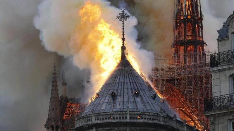 The inferno destroyed the roof of the 850-year-old UNESCO world heritage landmark, whose spectacular Gothic spire collapsed as orange flames and clouds of grey smoke billowed into the sky. (Photo: AP) The inferno destroyed the roof of the 850-year-old UNESCO world heritage landmark, whose spectacular Gothic spire collapsed as orange flames and clouds of grey smoke billowed into the sky. (Photo: AP)