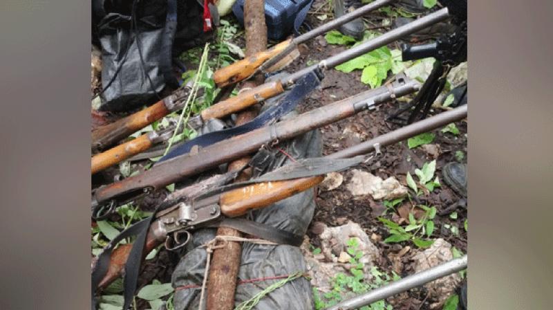 Bodies of the four Naxals along with seven weapons were recovered. (Photo: ANI) Bodies of the four Naxals along with seven weapons were recovered. (Photo: ANI)