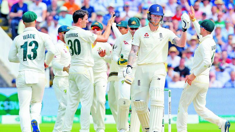 Australia celebrate as Ben Stokes walks back to the pavilion during day three of the first Ashes Test. (Photo: AFP) Australia celebrate as Ben Stokes walks back to the pavilion during day three of the first Ashes Test. (Photo: AFP)