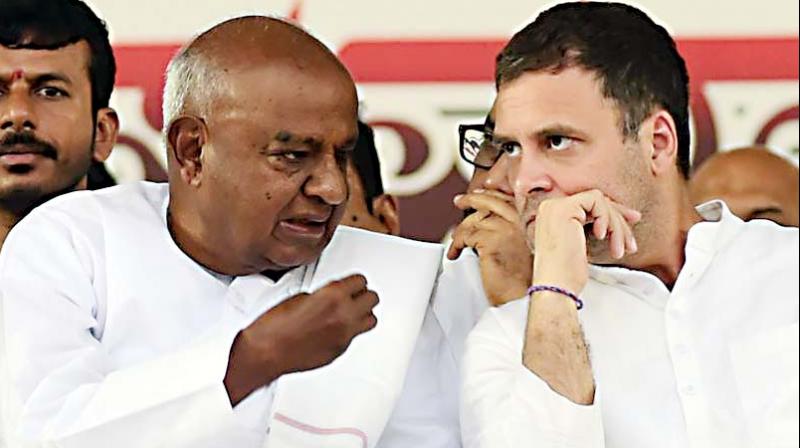 JD(S) supremo H.D.Deve Gowda with Congress chief Rahul Gandhi in this file photo. JD(S) supremo H.D.Deve Gowda with Congress chief Rahul Gandhi in this file photo.