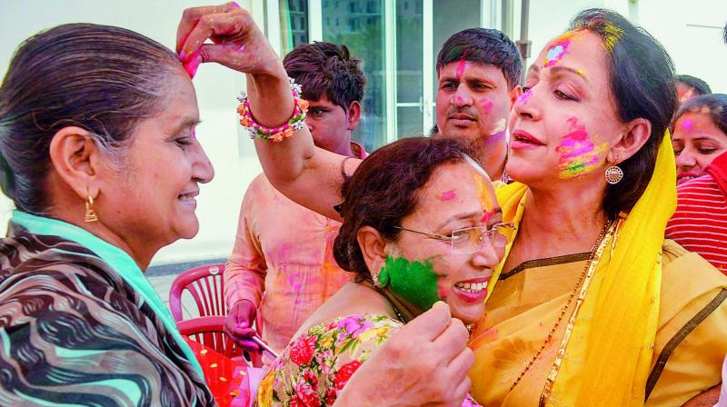 BJP MP and Bollywood actress Hema Malini celebrating Holi festival at her house in Vrindavan near Mathura on Thursday. (PTI) BJP MP and Bollywood actress Hema Malini celebrating Holi festival at her house in Vrindavan near Mathura on Thursday. (PTI)