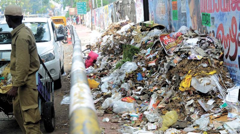 Corporation staff dump waste by th way side. (Photo: Peethambaran Payyeri) Corporation staff dump waste by th way side. (Photo: Peethambaran Payyeri)