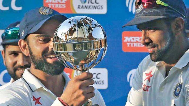Virat Kohli and R. Ashwin hold the ICC Test championship mace. The duo played key role in helping India reach No.1 Virat Kohli and R. Ashwin hold the ICC Test championship mace. The duo played key role in helping India reach No.1