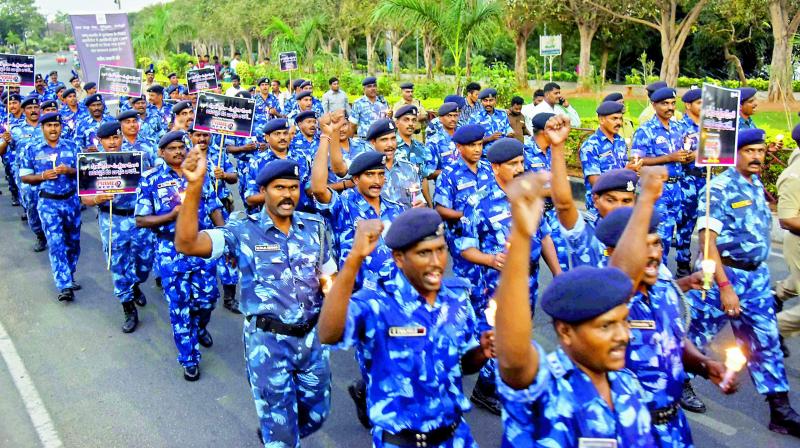 Hyderabad and Ranga Reddy district CRPF and RAF personnel take part in a candlelight march on Necklace Road on Friday in support of their colleagues killed in a terror attack in Pulwama, Jammu and Kashmir, on Thursday. — DC Hyderabad and Ranga Reddy district CRPF and RAF personnel take part in a candlelight march on Necklace Road on Friday in support of their colleagues killed in a terror attack in Pulwama, Jammu and Kashmir, on Thursday. — DC