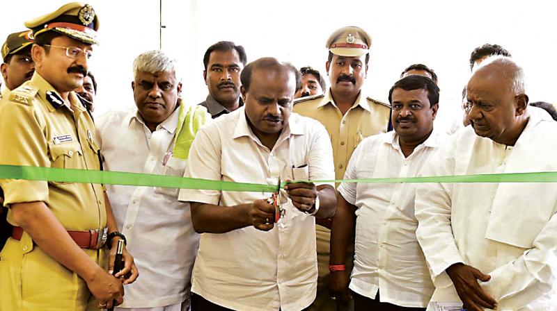 Chief Minister H.D. Kumaraswamy inaugurates the Police Office Complex in Hassan on Friday. Former PM H.D. Deve Gowda and Public Works Minister H.D. Revanna are seen – KPN Chief Minister H.D. Kumaraswamy inaugurates the Police Office Complex in Hassan on Friday. Former PM H.D. Deve Gowda and Public Works Minister H.D. Revanna are seen – KPN