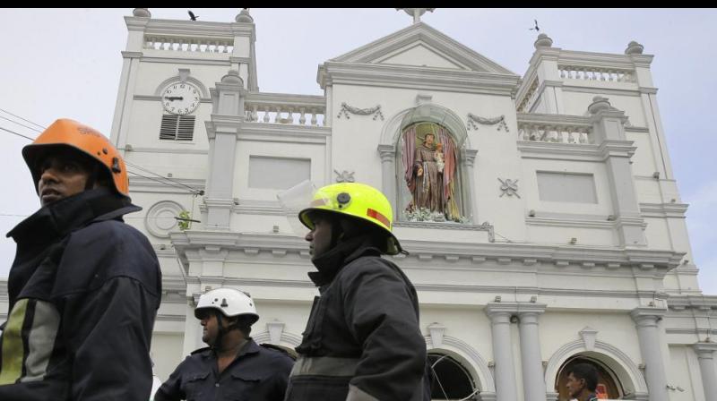 Sri Lankan firefighters stand in the area around St. Anthony's Shrine after a blast in Colombo, Sri Lanka. (Photo: AP) Sri Lankan firefighters stand in the area around St. Anthony's Shrine after a blast in Colombo, Sri Lanka. (Photo: AP)