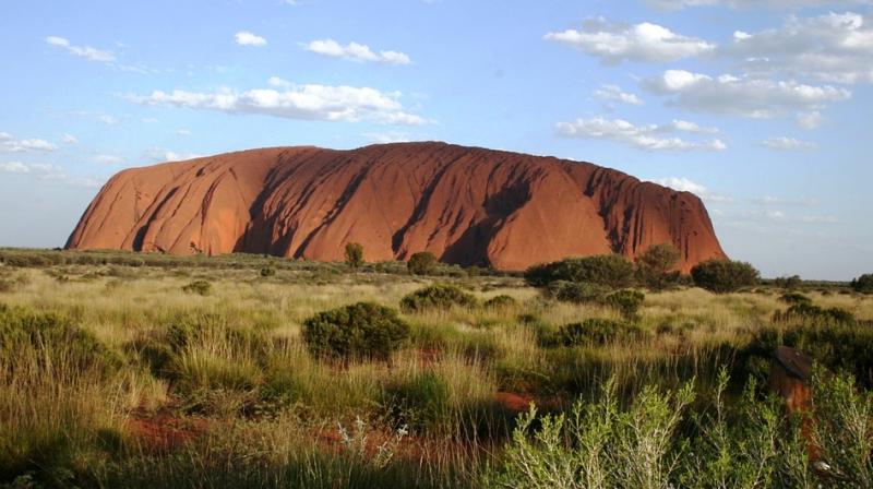 A permanent ban on scaling Uluru -- also known as Ayers Rock -- comes into place Saturday in line with the long-held wishes of the traditional Aboriginal owners of the land, the Anangu. (Photo: File)