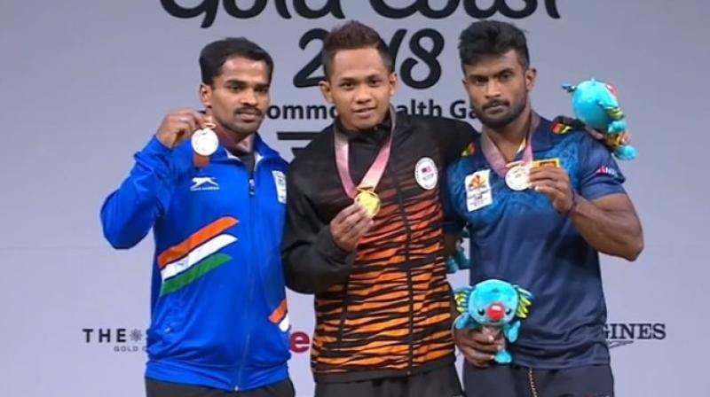P Gururaja (left) opened India's medal account on the first competition day of the 21st Commonwealth Games, claiming a silver in the men's 56kg category. (Photo: Twitter / IOA)/ P Gururaja (left) opened India's medal account on the first competition day of the 21st Commonwealth Games, claiming a silver in the men's 56kg category. (Photo: Twitter / IOA)/