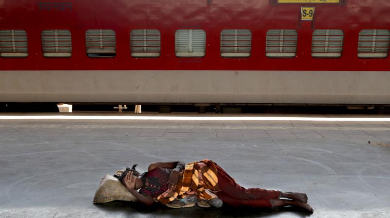 A homeless woman sleeps on a deserted platform of the Lokmanya Tilak train terminus in Mumbai. (File photo: AP) A homeless woman sleeps on a deserted platform of the Lokmanya Tilak train terminus in Mumbai. (File photo: AP)