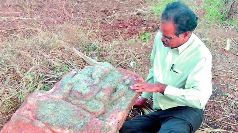 Archaeologist E. Sivanagi Reddy with the Ganesha idol. Archaeologist E. Sivanagi Reddy with the Ganesha idol.