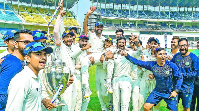 Vidarbha celebrate their Ranji trophy triumph. (PTI) Vidarbha celebrate their Ranji trophy triumph. (PTI)