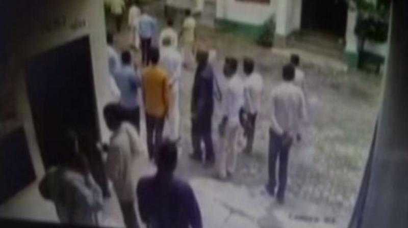 His co-workers on Thursday took out a large scale protest demanding strict action against the accused. (Photo: ANI) His co-workers on Thursday took out a large scale protest demanding strict action against the accused. (Photo: ANI)