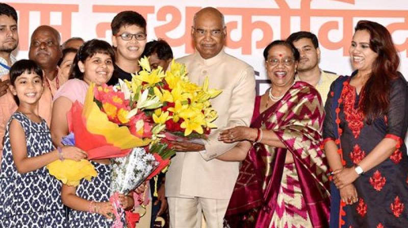 Ram Nath Kovind along with his wife Savita accepting greetings on being elected as the 14th President of India, in New Delhi on Thursday. (Photo: PTI) Ram Nath Kovind along with his wife Savita accepting greetings on being elected as the 14th President of India, in New Delhi on Thursday. (Photo: PTI)
