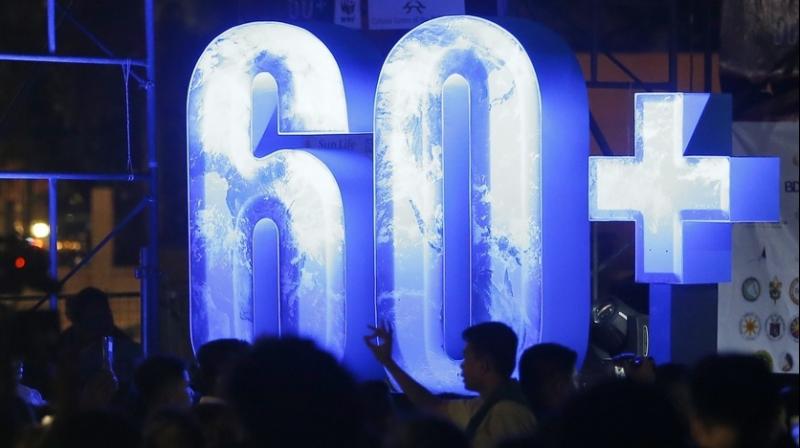 In countries around the world, at 8:30 p.m., people were switching off their lights for Earth Hour. (Photo: AP) In countries around the world, at 8:30 p.m., people were switching off their lights for Earth Hour. (Photo: AP)