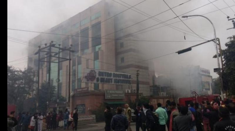 Thick smoke could be seen billowing out of the building in Sector 12. (Photo: ANI) Thick smoke could be seen billowing out of the building in Sector 12. (Photo: ANI)