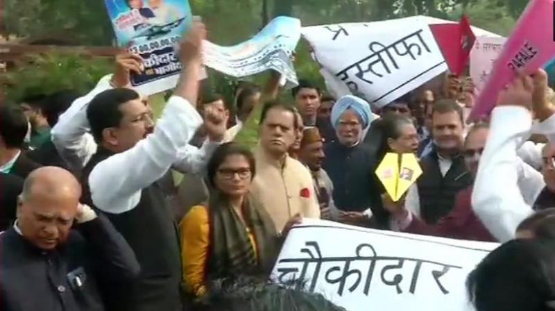 The Congress leaders were seen carrying paper planes and posters, alleging scam in the multi-crore fighter jet deal. (Photo: ANI | Twitter) The Congress leaders were seen carrying paper planes and posters, alleging scam in the multi-crore fighter jet deal. (Photo: ANI | Twitter)