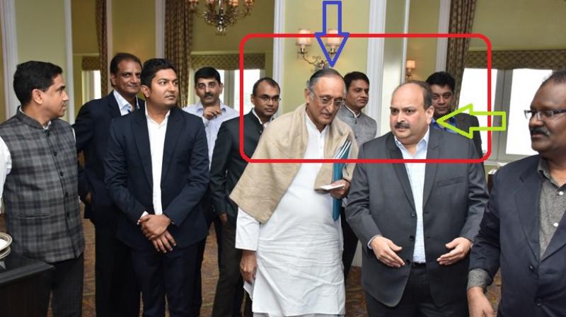 West Bengal BJP released photographs of state Finance Minister Amit Mitra with founder of Gitanjali Gems Mehul Choksi who is on the run in the Punjab National Bank (PNB) fraud case. (Photo: Twitter | @DilipGhoshBJP) West Bengal BJP released photographs of state Finance Minister Amit Mitra with founder of Gitanjali Gems Mehul Choksi who is on the run in the Punjab National Bank (PNB) fraud case. (Photo: Twitter | @DilipGhoshBJP)