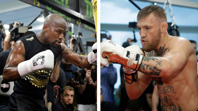 Move for lighter gloves is widely seen as benefiting both fighters as Mayweather's fast hands could be quicker with lighter gloves, while McGregor will be able to make his punching power more keenly felt.(Photo:AP) Move for lighter gloves is widely seen as benefiting both fighters as Mayweather's fast hands could be quicker with lighter gloves, while McGregor will be able to make his punching power more keenly felt.(Photo:AP)