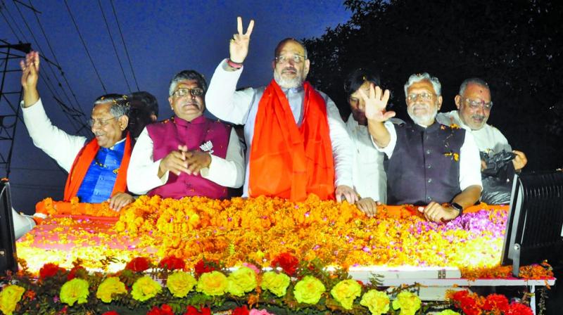 BJP president Amit Shah with Sushil Kumar Modi and party’s Patna Sahib candidate Ravi Shankar Prasad during a roadshow in Patna on Saturday. (PTI) BJP president Amit Shah with Sushil Kumar Modi and party’s Patna Sahib candidate Ravi Shankar Prasad during a roadshow in Patna on Saturday. (PTI)