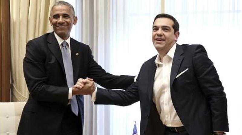 U.S. President Barack Obama, left, shakes hands with the Greek Prime Minister Alexis Tsipras during their meeting at Maximos Mansion in Athens. (Photo: AP) U.S. President Barack Obama, left, shakes hands with the Greek Prime Minister Alexis Tsipras during their meeting at Maximos Mansion in Athens. (Photo: AP)